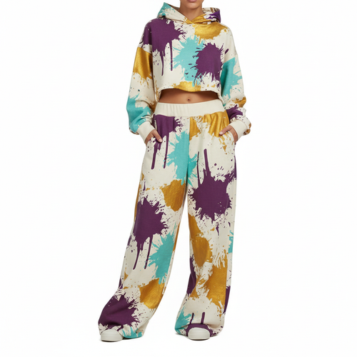 Wide-leg pants with bold abstract paint splash print in purple, gold and teal on cream
